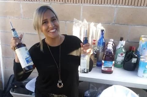 SoCal Bartender mixologist with cocktail ingredients at an outdoor Southern California event