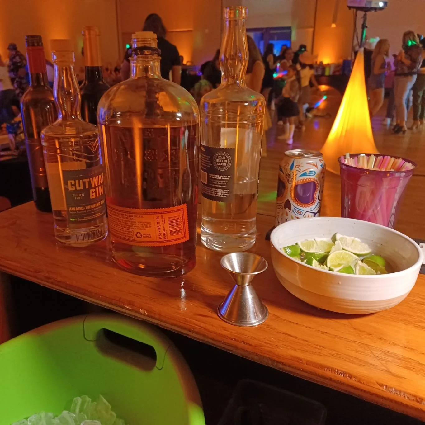 Premium mobile bar setup with craft spirits and fresh limes at a SoCal event